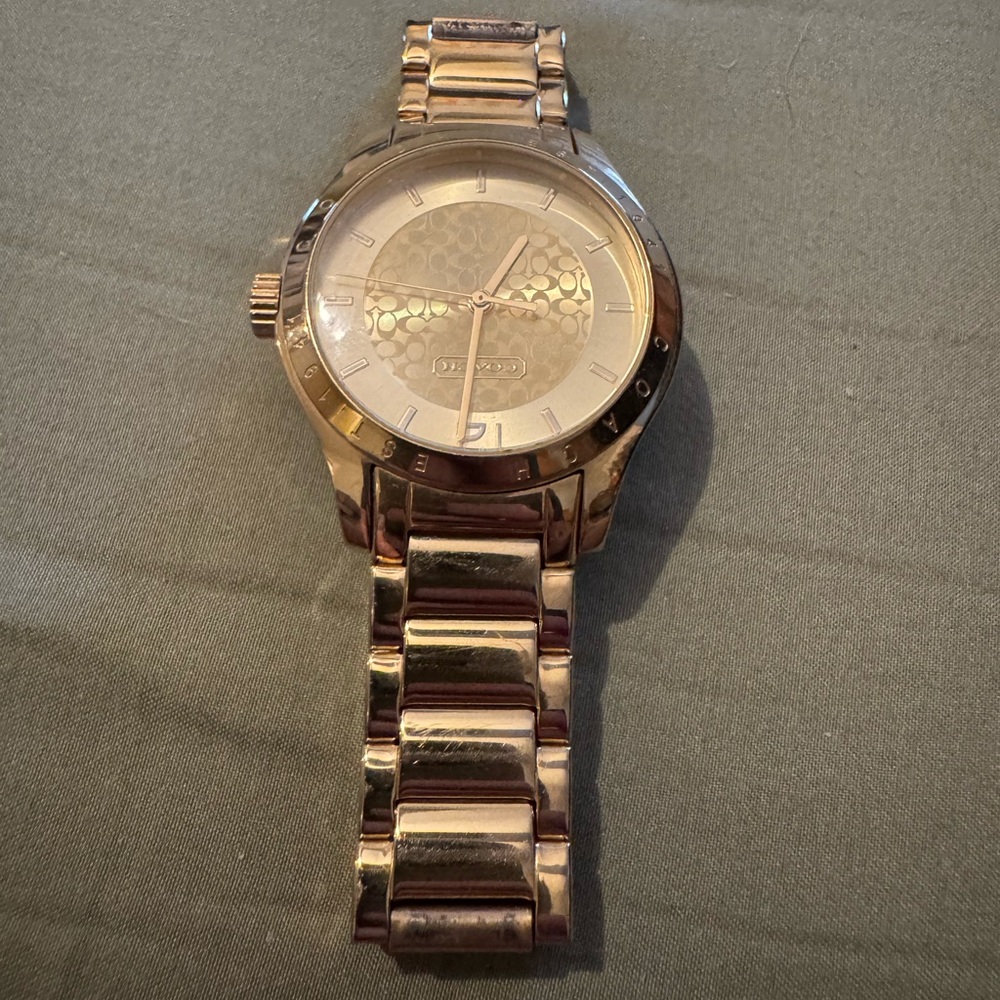 Women’s gold Coach watch